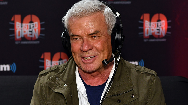 Eric Bischoff smiling and wearing a headset