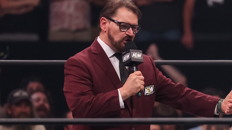 Tony Schiavone holding an AEW microphone