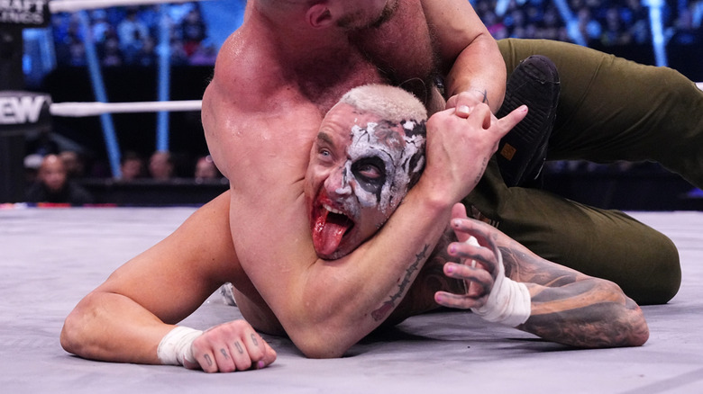 Jon Moxley choking Darby Allin