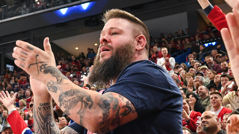Kevin Owens applauds at a Montreal Canadiens game