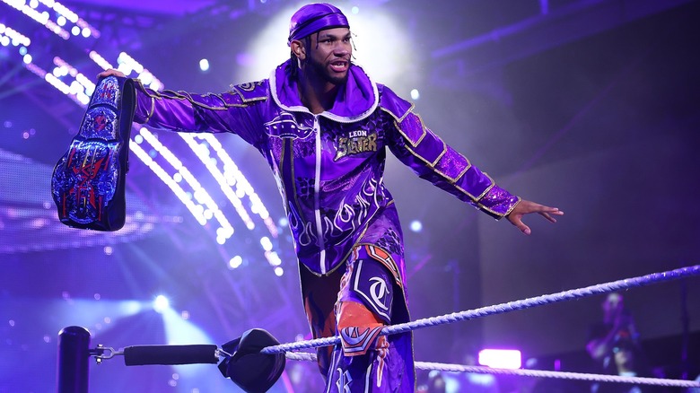 TNA X-Division Champion Leon Slater proudly holds his title up before a scheduled title defense