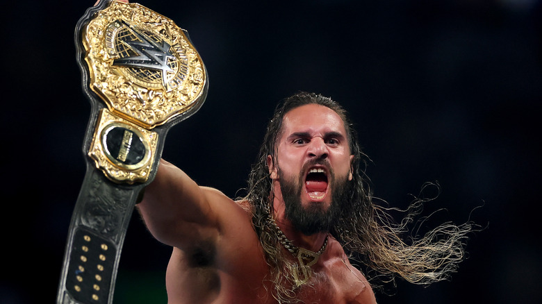 Seth Rollins celebrates after winning the WWE World Heavyweight Championship after cashing in his Money in the Bank contract to take on CM Punk during the WWE 2025 SummerSlam at MetLife Stadium on August 02, 2025 in East Rutherford, New Jersey.