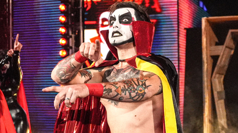 Danhausen doing his curse gesture