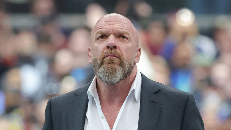 Triple H looking up at the crowd
