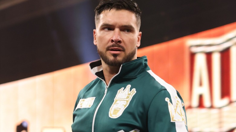 Ethan Page wearing a green jacket