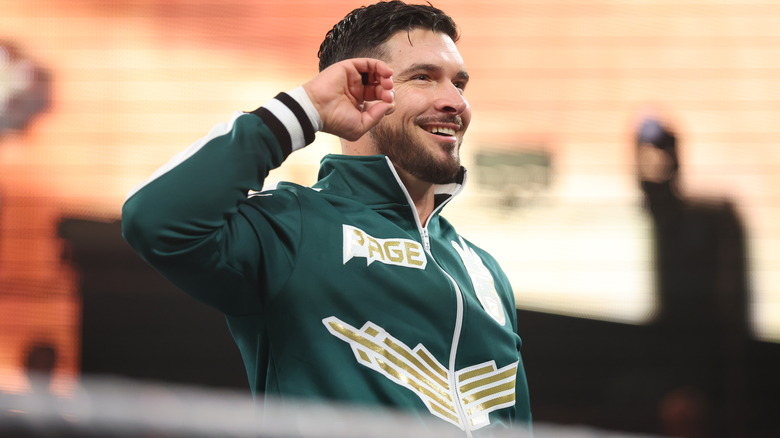 Ethan Page hits his signature smile-and-point pose.