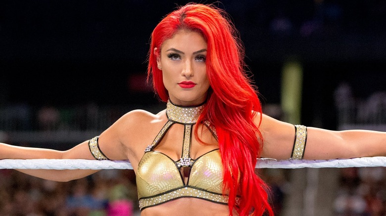Eva Marie leaning on ring ropes