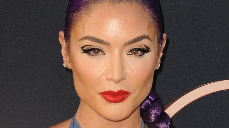 Eva Marie posing at a press event 