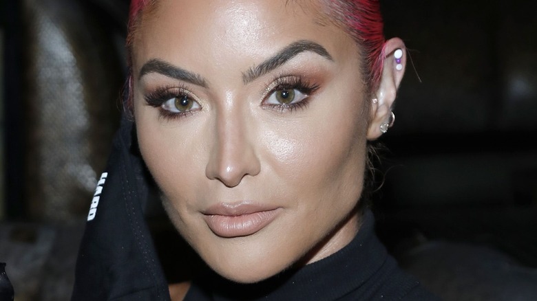 Eva Marie poses at a press event 