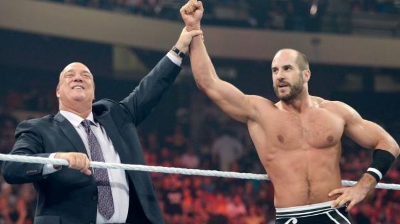 Paul Heyman raises Cesaro's arm