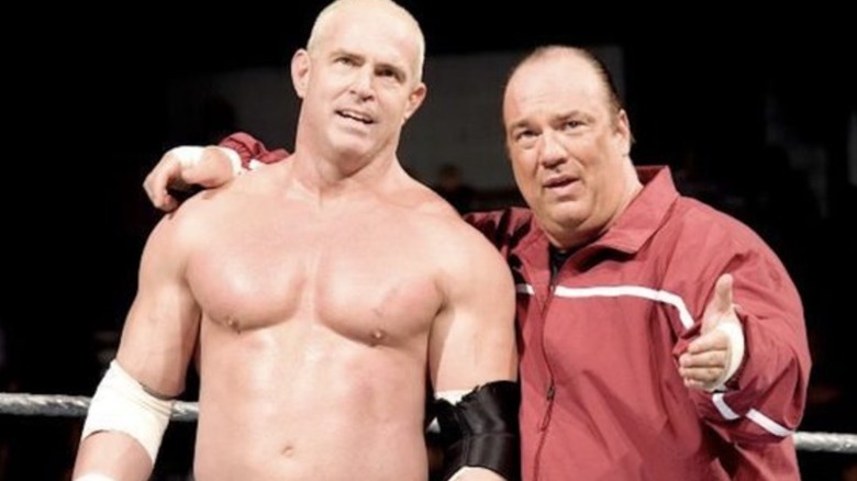 Paul Heyman arm around Hardcore Holly