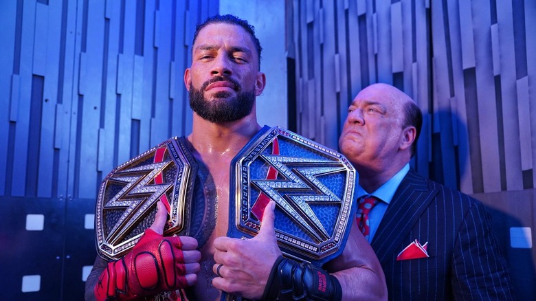 Paul Heyman looks proudly at Roman Reigns