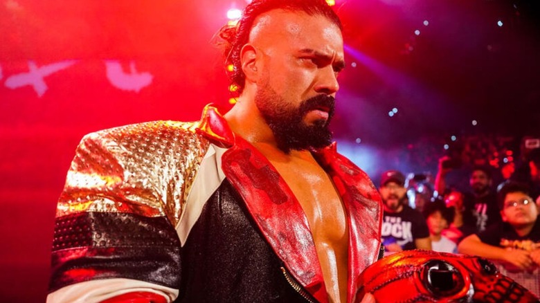Andrade heads to the ring, mask in hand, before a match on "WWE SmackDown."