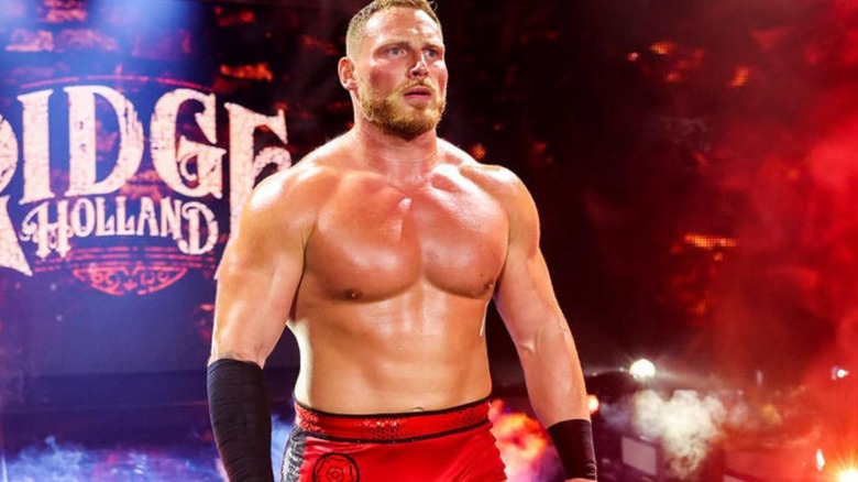 Ridge Holland stands on the stage and looks to the ring during his entrance on an episode of "WWE NXT."
