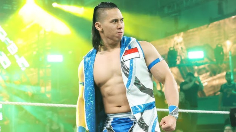 Dante Chen wearing a white and green vest