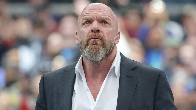 Triple H wearing a suit