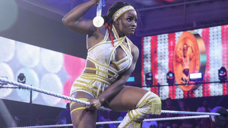 Tyra Made Steele holding a medal