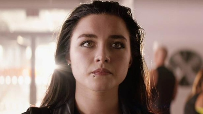 Florence Pugh stares ahead