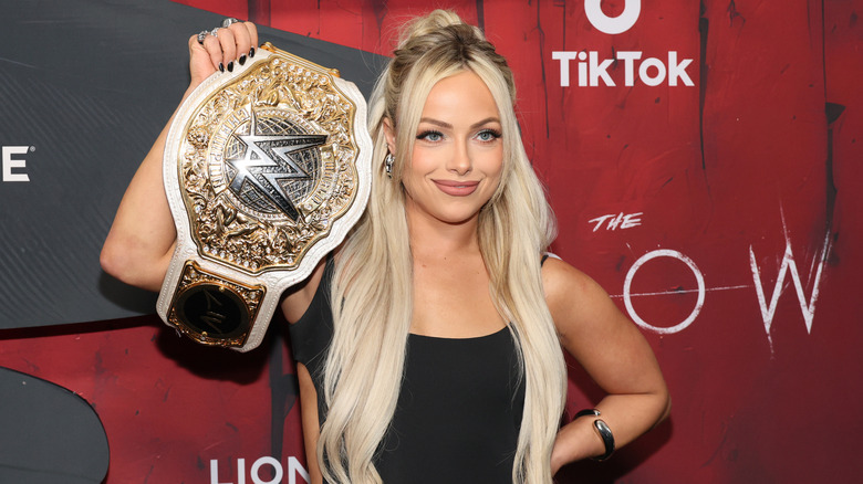The WWE Women's World Champion Liv Morgan poses at a red carpet event