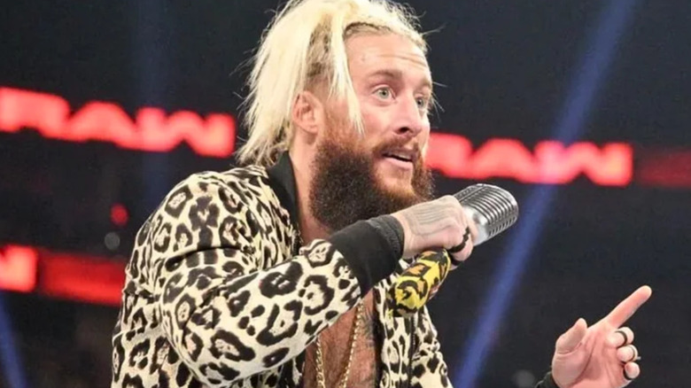 Enzo Amore holding a microphone