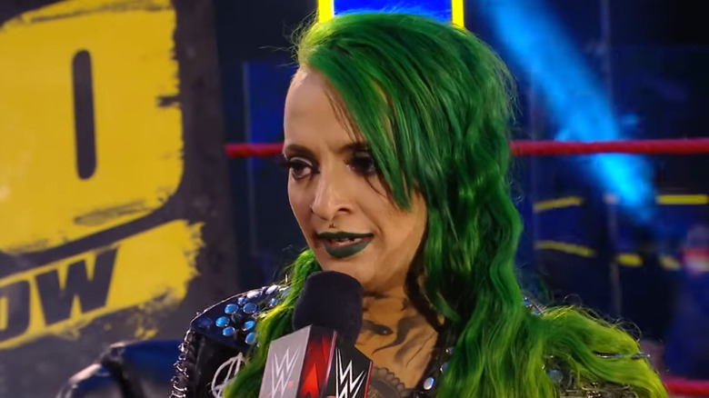 Ruby Riott holding a microphone inside the ring