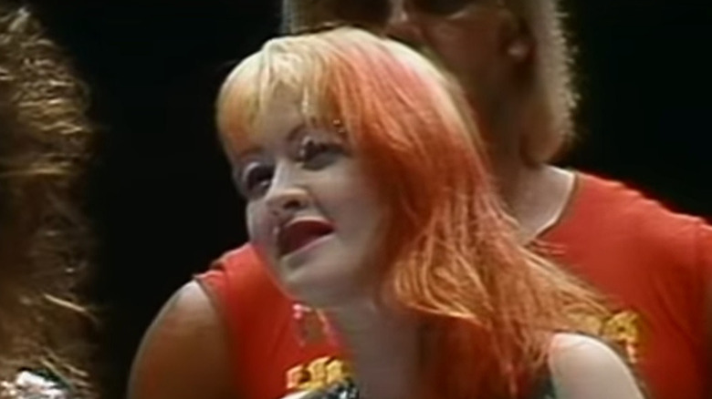 Cyndi Lauper standing near Hulk Hogan
