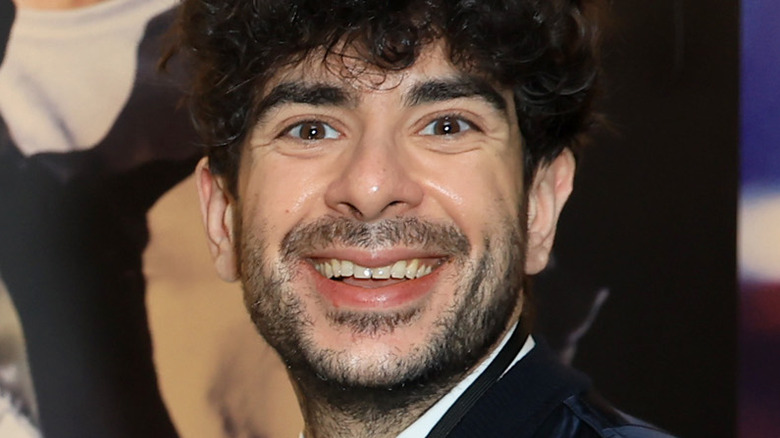 Tony Khan smiles