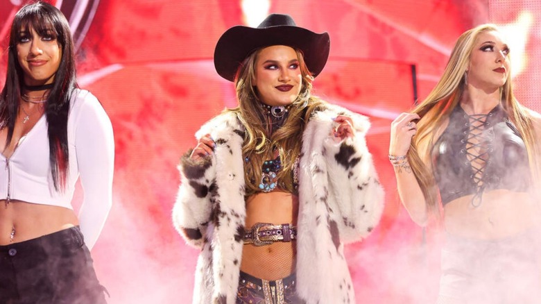 Fallon Henley heads down to the ring with Fatal Influence stablemates Jacy Jayne and Lainey Reid before a match on 