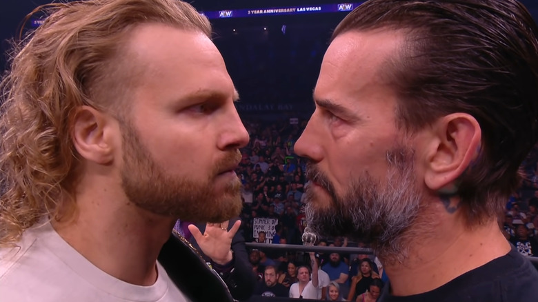 Adam Page and CM Punk staring each other down