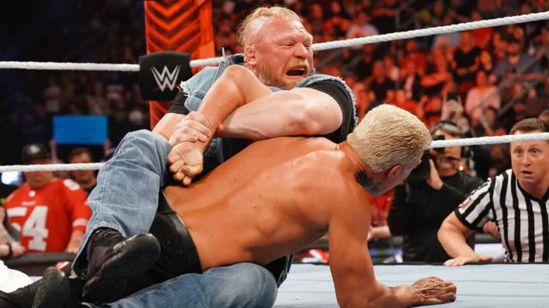 Brock Lesnar trapping Cody Rhodes in Kimura Lock