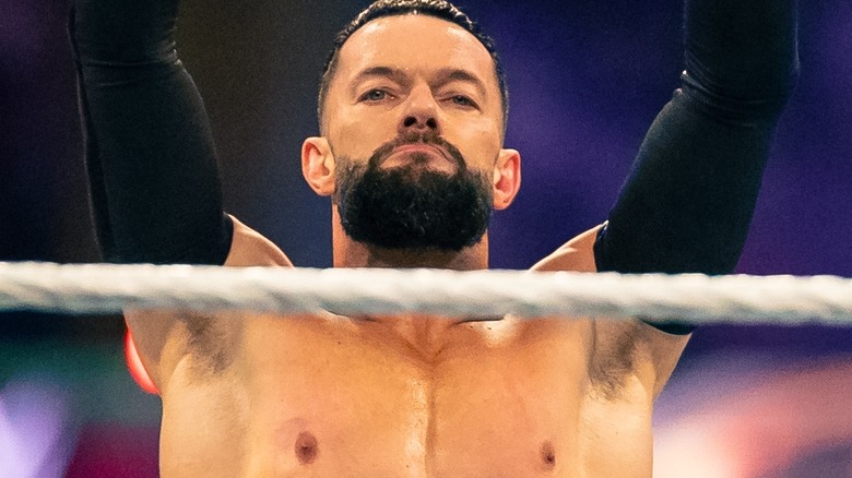 Finn Bálor raises his arms