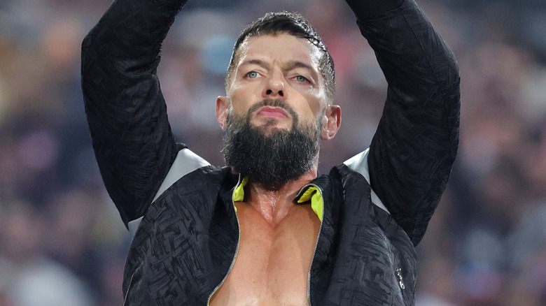 Finn Balor raising his arms