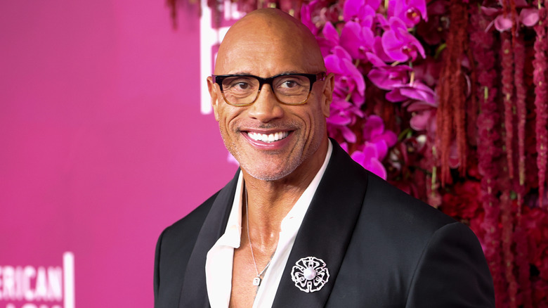 The Rock smiles at an event