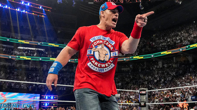 Cena points to an adoring crowd at Money in the Bank.