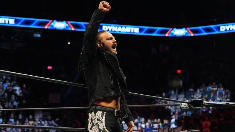Adam Page raises a fist