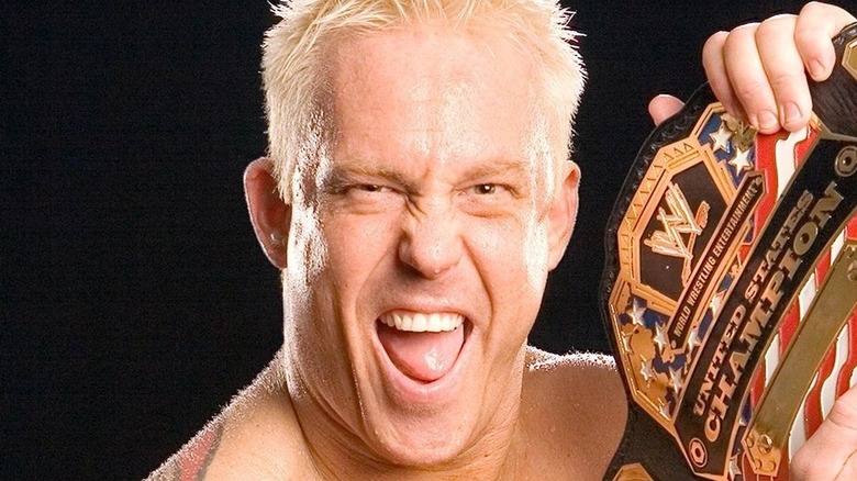 Mr. Kennedy posing with the WWE United States Championship for a promotional shoot.