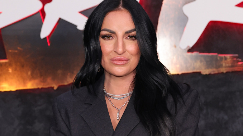 Sonya Deville wearing a silver necklace