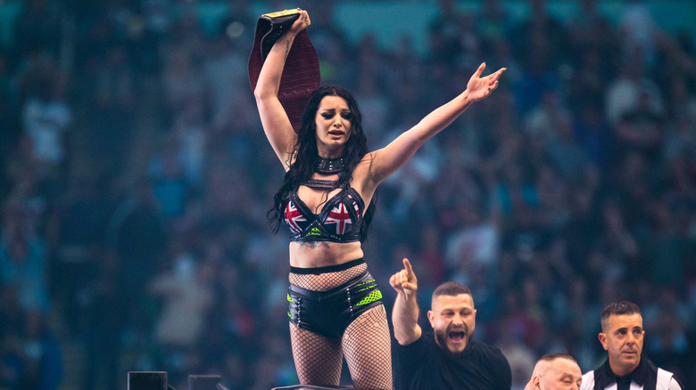 Saraya celebrates with the AEW Women's Title