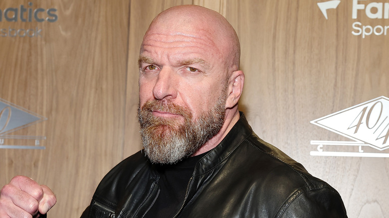 Triple H holds up a fist