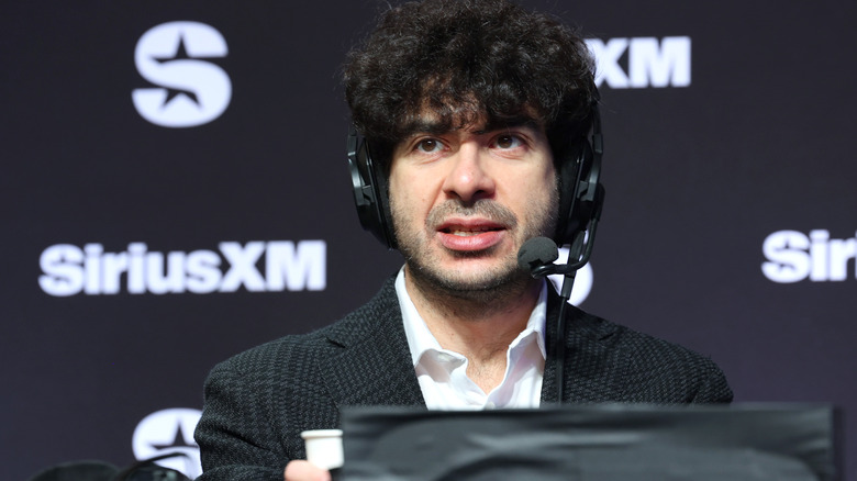 Tony Khan in front of a Sirius XM banner