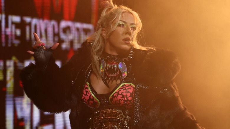 Thekla wearing a black fur coat