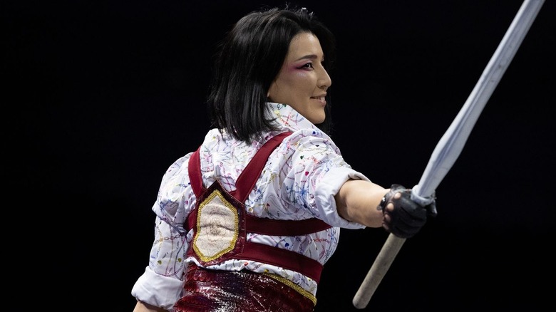 Hikaru Shida is holding a kendo stick