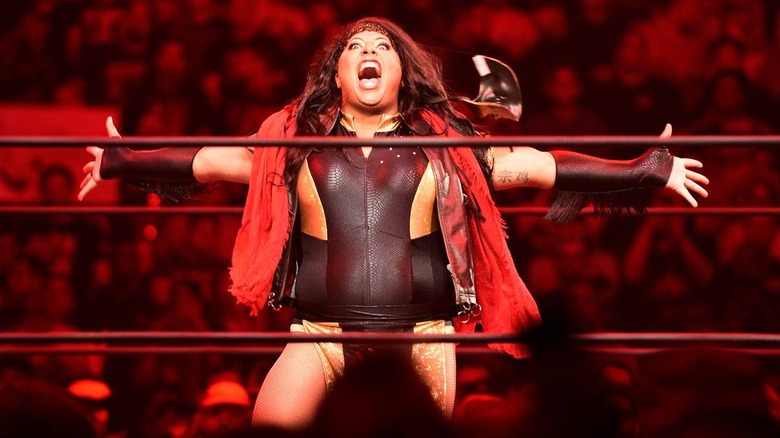 Nyla Rose poses in the middle of the ring before tearing it up in AEW