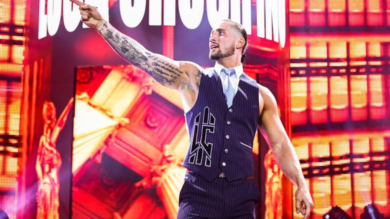 Luca Crusifino poses on the stage during his entrance before a match on 