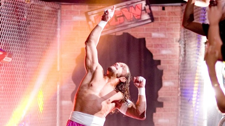 Sabu points to the sky ahead of his match