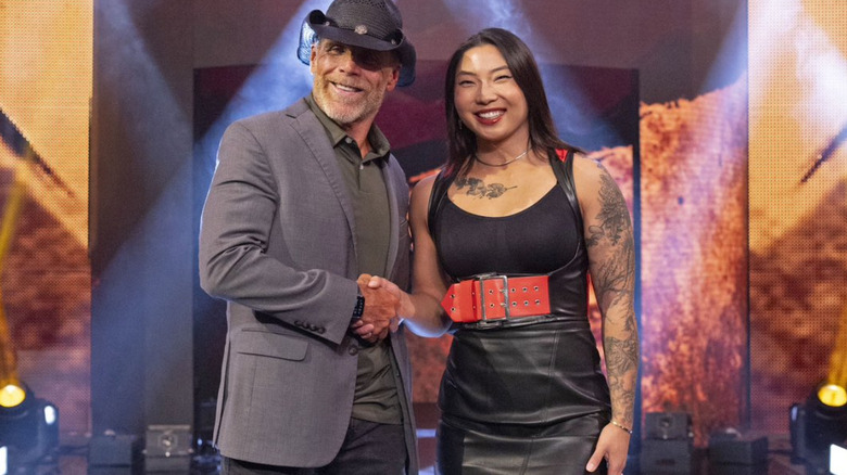 Jin Tala shaking hands with Shawn Michaels