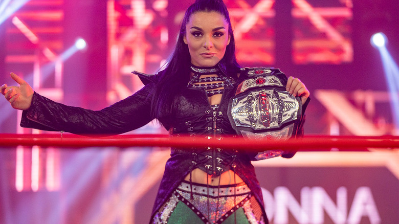 Deonna Purrazzo poses proudly with the Impact Knockouts Championship.
