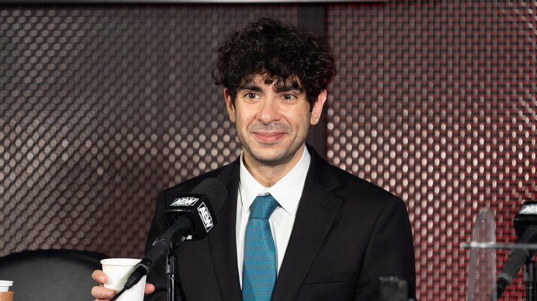 Tony Khan at a press conference 