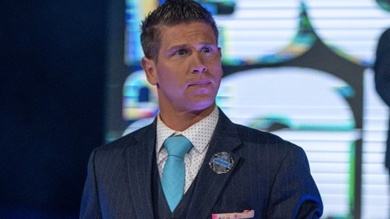 Josh Matthews wearing a suit