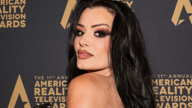 Saraya looking over her shoulder